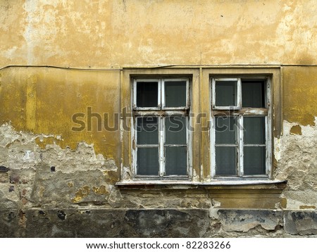 old dirty windows on old dirty wall
