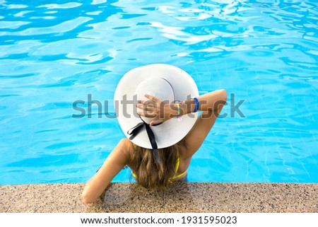 Image, Stock Photo Anonymous woman sunbathing on rocky beach