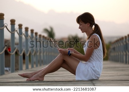 Similar – Image, Stock Photo A warm summer evening with a clear blue sky, calm sea, and golden dunes in Karkle, Lithuania. Oh, and a gorgeous blonde girl in a red summer dress. Just relaxing and enjoying this perfect weather.