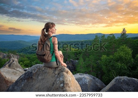 Similar – Image, Stock Photo Lone female hiker contemplating the clouds from the top of a mountain