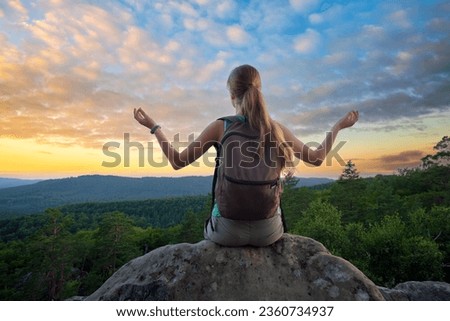 Similar – Image, Stock Photo Lone female hiker contemplating the clouds from the top of a mountain