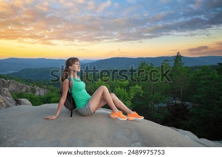 Image, Stock Photo Lone female hiker contemplating the clouds from the top of a mountain