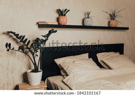 Similar – Foto Bild Das Bett ist mit sauberen weißen Kissen und Bettwäsche im Zimmer ausgestattet.