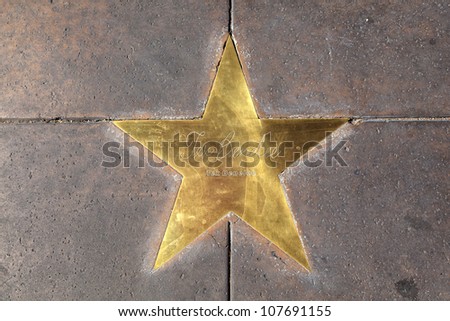 PHOENIX, USA - June 14: star of Tex Benelee in copper reflect the past glory of the Hotel San Carlos on June 14,2012 in Phoenix, USA. The stars in the sidewalk were put in in 1993 due to their visits.