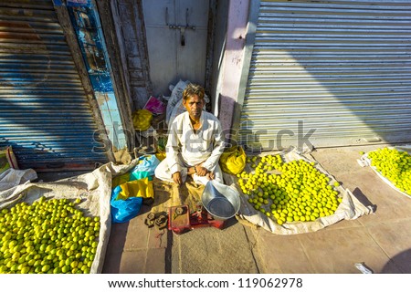 NEW DELHI - OCTOBER 16: Typical vegetable street market in India on October 16, 2012 in New Delhi, India. Food hawkers in India are generally unaware of standards of hygiene and cleanliness.