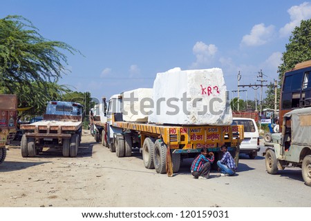 PADANGANJ, INDIA - OCTOBER 21: lorry transports huge marble stones from the pit on highway 7 to resellers all over india on October 21,2012 in Padanganj, india.