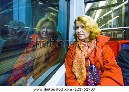woman in subway by night