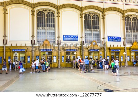 BUDAPEST, HUNGARY - AUGUST 04:  people buy tickets in the famous West Train Station on August 4, 2008 in Budapest, Hungary. The  Station was constructed by Gustafe Eiffel.