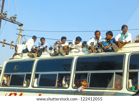 JODHPUR, INDIA - OCTOBER 23: people travel by bus in Jodhpur on October 23, 2012. Unsatisfactory quantity & quality of public transportation limit people in everyday traveling.