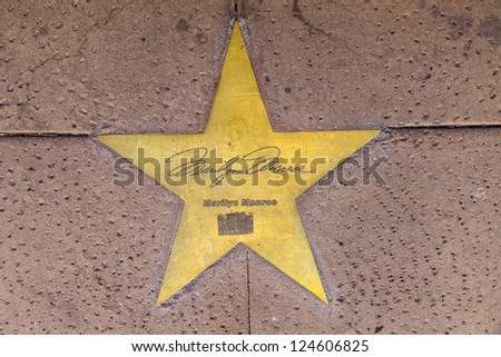 PHOENIX, USA - JUNE 14: Marilyn Monroe in copper reflect the past of the Hotel San Carlos on June 14,2012 in Phoenix, USA. The stars in the sidewalk were put in in 1993 to commemorate their visits.