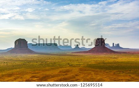 giant Buttes, formations  made of sandstone in the Monument valley seen from Artists point at sunset