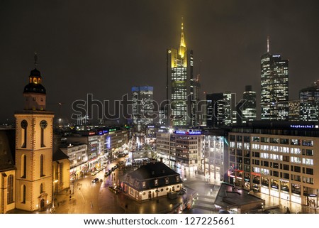 FRANKFURT, GERMANY - FEB 5: view to skyline with Hauptwache and skyscraper by night on February 5, 2013 in Frankfurt,Germany. It is the fifth-largest city in Germany with a 2012 population of 704,449.