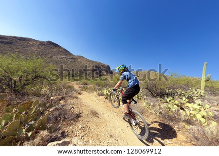 TUSCON, USA - JUNE 11: downhill bike rider in TUSCON, USA on June 11, 2012.  There are around 1,000 bicycle related deaths in the United States each year, 75% of which are due to head injuries.