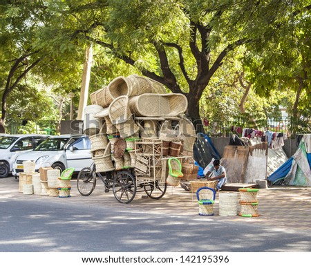 DELHI, INDIA - OCTOBER 14: man sells ratan furniture on October 14,2012 in Delhi, India. Rattan is a cheap natural product from bamboo and used for furniture production in india.