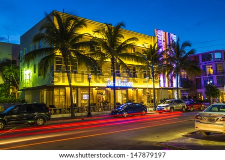 MIAMI BEACH - July 28: Night view at Ocean drive on July 28, 2013 in Miami Beach, Florida. Art Deco Night-Life in South Beach at ocean drive  is one of the main tourist attractions in Miami.