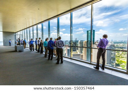 HOUSTON, USA - JULY 11: people enjoy the scenic view from JPMorgan Chase tower on July 11, 2013 in Houston, USA. The visitor platform is open to public during office hours without entrance fee.