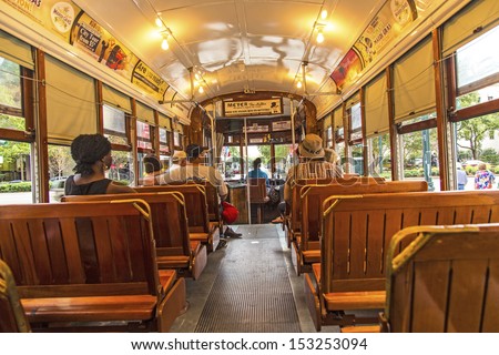NEW ORLEANS - JULY 17: people travel with the famous old Street car St. Charles line on July 17, 2013 in New Orleans, USA.  It is the oldest continually operating street car line in the world.
