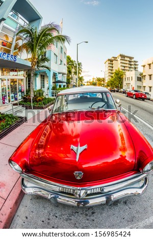 MIAMI, USA - July 31: classic Ford car parks in the art deco district on July 31, 2013 in Miami Beach, Florida. Art Deco Life in South Beach is one of the main tourist attractions in Miami.