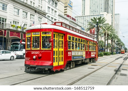 NEW ORLEANS - JULY 16: people travel with the Street car Canal street line St. Charles line on July 16, 2013 in New Orleans, USA.  It is the oldest continually operating street car line in the world.