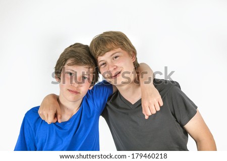 portrait of two friends hugging and posing