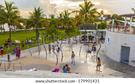 MIAMI, USA - JULY 28:  people use the shower facilities at the public beach on July 28, 2013 in Miami, USA. South beach offers free restrooms and shower facilities at every public beach.