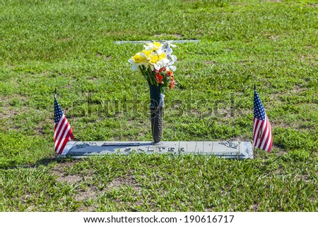 SVANSBORO, USA - JULY 20: american cemetery with flowers at the graves at July 20, 2010 near Svansboro, USA. In US there are more than 300000 cemeteries without private ones.