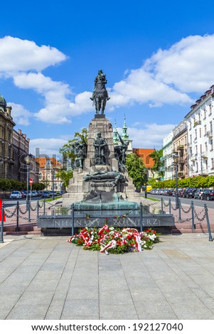 KRAKOW, POLAND - SEPTEMBER 5: A figure of a defeated knight on the monument dedicated to the battle of Grunwald on Sep 5, 2014 in Old town of Krakow, Poland.