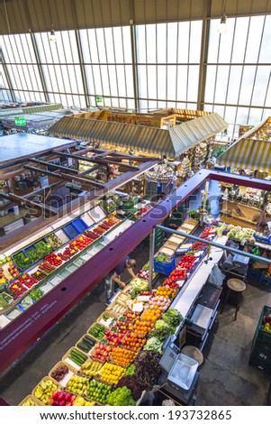 FRANKFURT, GERMANY - MAY 19, 2014: people enjoy shopping in the Kleinmarkthalle  in Frankfurt, Germany. The hall from 1954 is the most famous fresh food market in Frankfurt on 1500 SQ (m2).