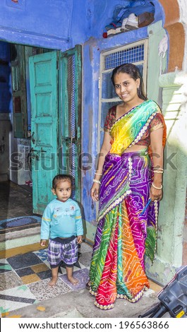 JODPUR, INDIA - OCTOBER 23, 2012: indian proud mother poses with her child in Jodhpur, India. Jodhpur is the second largest city in the Indian state of Rajasthan with over 1 million habitants.