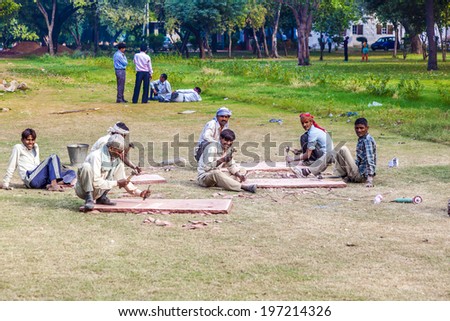 DELHI, INDIA - NOV 9, 2011: stone cutter work in the Red Fort in Delhi, India. Red Fort is a 17th century fort complex and was designated a UNESCO World Heritage Site in 2007.