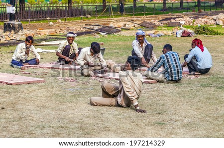 DELHI, INDIA - NOV 9, 2011: stone cutter work in the Red Fort in Delhi, India. Red Fort is a 17th century fort complex and was designated a UNESCO World Heritage Site in 2007.