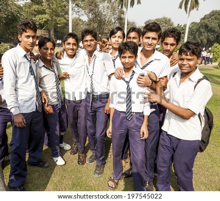 DELHI, INDIA NOV 11, 2011: unidentified school class visits Humayuns tomb in Delhi, India. The boys in school uniform have fun posing for a foto. Schools visit the famous landmarks as part of national education.
