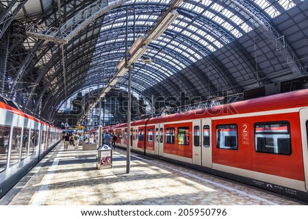FRANKFURT, GERMANY - JULY 19, 2014: people Inside the Frankfurt central station in Frankfurt, Germany. With about 350.000 passengers per day its the most frequented railway station in Germany.