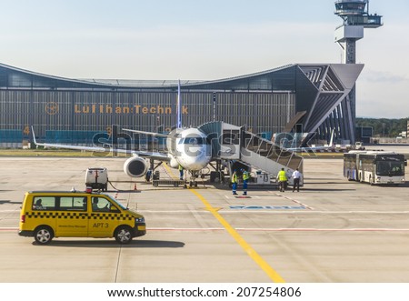 FRANKFURT, GERMANY - June 20, 2013: Lufthansa aircraft in front of maintanance hall in Frankfurt Germany. The new runway opened  2012 and causes a lot of polictical discussion because of heavy noise.