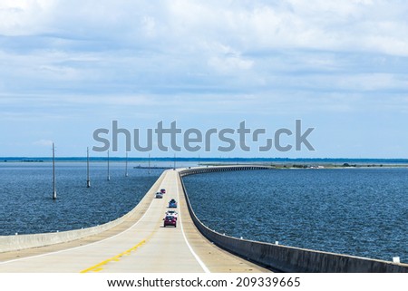DAUPHIN ISLAND, USA - JULY 18, 2013: crossing the Dauphin Island Bridge in Dauphin Island, USA. The original bridge opened on July 2, 1955 under the name Gordon Persons bridge.