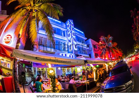MIAMI, USA - AUG 19, 2014: people enjoy Ocean drive nightlife in  Miami, USA. Art Deco district architecture is one of the main tourist attractions in Miami.
