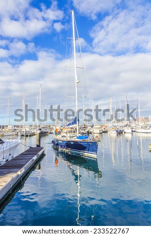 PLAYA BLANCA, SPAIN - NOV 18, 2014: Boats lie in the harbor Marina Rubicon in Playa Blanca, Spain. The Marina opened in 2003 and provides 500 berth for boats up to 70 m length.