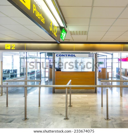 ARRECIFE, SPAIN - NOV 21, 2014: Police control at airport of Arrecife, Spain.  In 1999 a new passenger terminal opened with a capacity of 6 million passengers per annum.