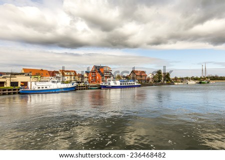 WOLGAST, GERMANY - APRIL 15, 2014: view to riverside of old village of Wolgast, Germany. The peene river at Wolgast is deep enough to serve the dockyards in Wolgast.