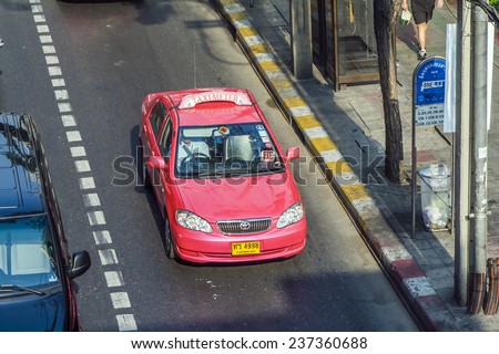 BANGKOK, THAILAND - JAN 9, 2008: taxi driver without passenger in Bangkok, Thailand. There are 150,000 taxis in Bangkok. All are metered with the starting fee of 35 Baht for the first 3 kilometers.