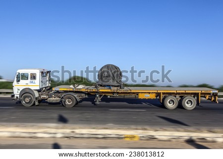 JEWAR BANGER, INDIA - NOV 12, 2011: truck uses the Yamuna express way in Jewar Banger, India. The Highway is a toll road and was finally inaugurated at August 2011.
