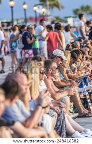 KEY WEST, USA - AUG 26, 2014: people enjoy the sunset point at Mallory square in Key West, USA. This place is the most popular sunset point in Key West.