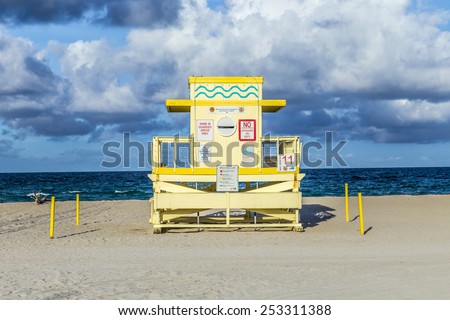 MIAMI, USA - AUG 1, 2013: life guard tower on South Beach in sunset in Miami, USA. The 27 colorful life guard towers are a main attraction at south beach and famous for their colorful art deco style.