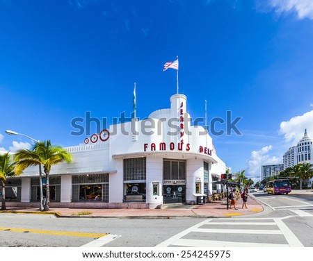 MIAMI, USA - AUG 5, 2013: people go to Jerrys famous Deli at the Main street in Miami, USA. Jerry Famous Deli was originally built as Hoffmans Cafeteria and opened first in 1939.