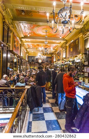 LISBON, PORTUGAL - DEC 27, 2008: people enjoy the Cafe A Brasileira in Lisbon, Portugal. The Cafe  is one of the oldest and most famous cafes in the old quarter of Lisbon.