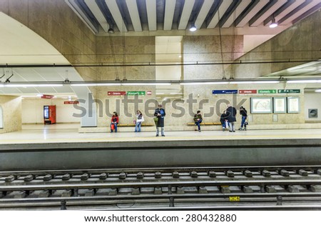 LISBON, PORTUGAL - DEC 27, 2008: people wait in the  famous Oriente metro Station for the train in Lisbon, Portugal. With  75 million passengers per year it is the largest station in Lisbon.