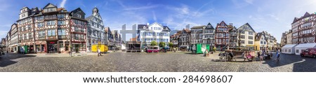 BUTZBACH, GERMANY - JUNE 4, 2015: people enjoy the beautiful medieval market place in Butzbach, Germany. Butzbach is also called the pearl of the Wetterau.