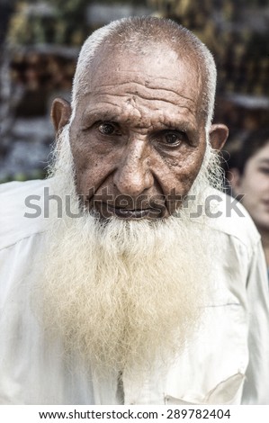 GILGIT, PAKISTAN - JUNE 30, 1987: portrait of unknown elderly man with white beart in Gilgit, Pakistan. People suffer in that area because of the Afghanistan war.