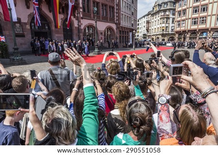 FRANKFURT, GERMANY - JUNE 26, 2015: queen Elizabeth leaves the town hall  in Frankfurt, Germany. She walks back to her car on the red carpet.