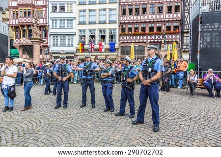 FRANKFURT, GERMANY - JUNE 26, 2015: police pays attention for the visit of queen Elizabeth II at the Roemer market square in Frankfurt, Germany.